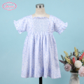 honeycomb-smocked-dress-white-floral-on-blue-for-girl---ld524